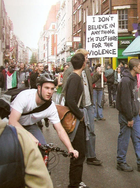 funny-picture-protester-sign-believe-street